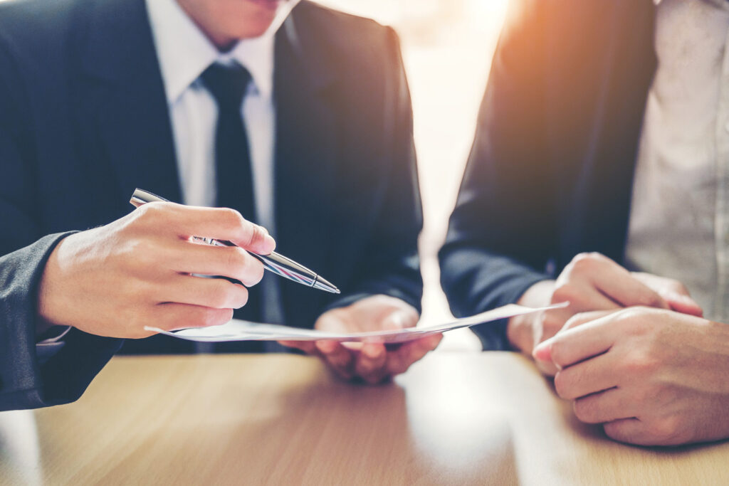 two people discussing a contract